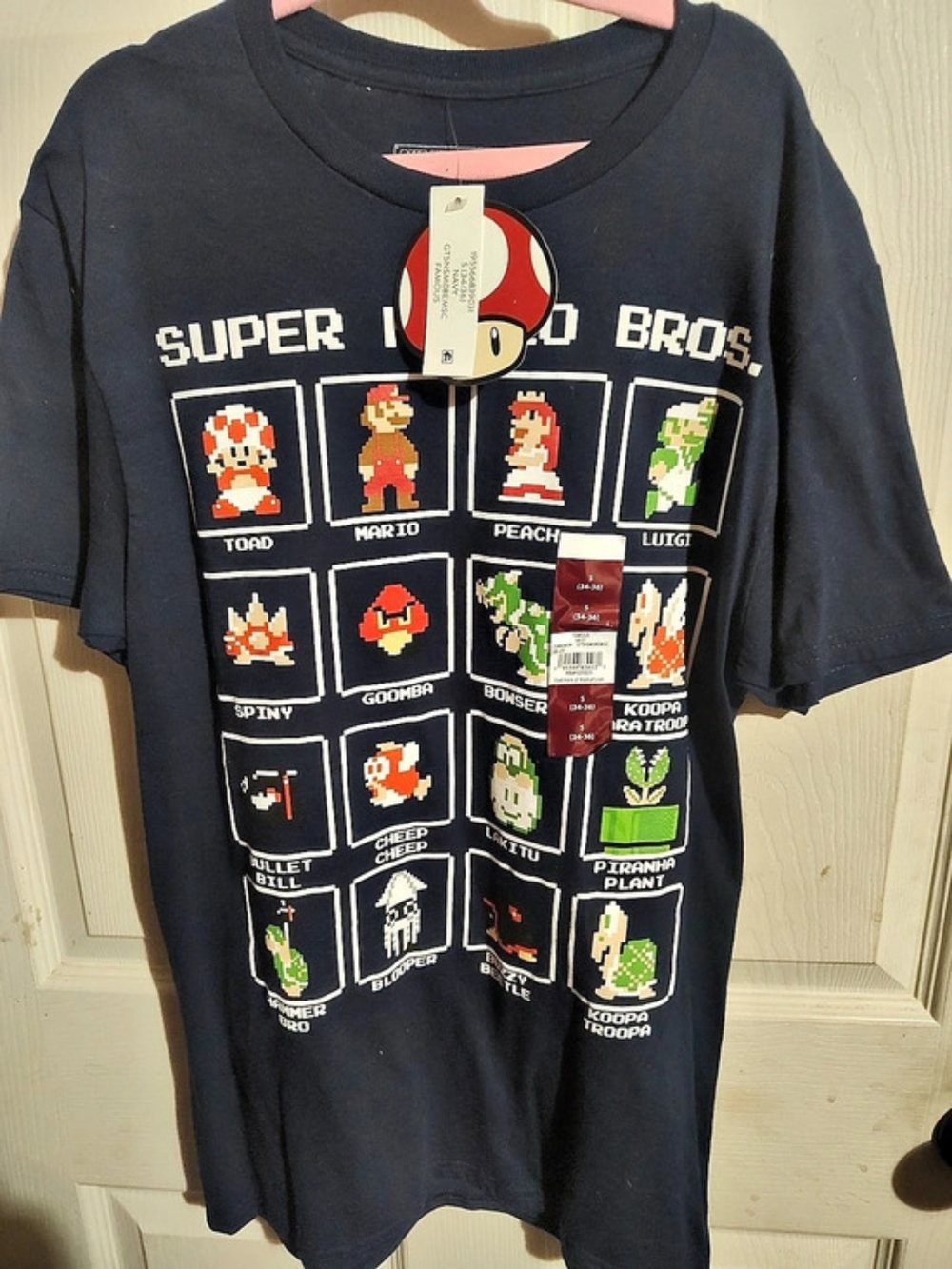 Nintendo Super Mario Bros. Mushroom Characters Tee Graphic Tee in Navy.